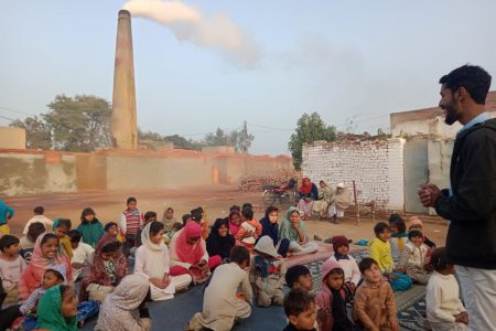 Pakistani brick kiln people hearing the gospel of Jesus Christ from an evangelist